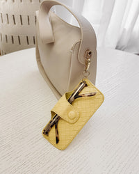 SKITTLE SUNGLASS CASE WOVEN BUTTER