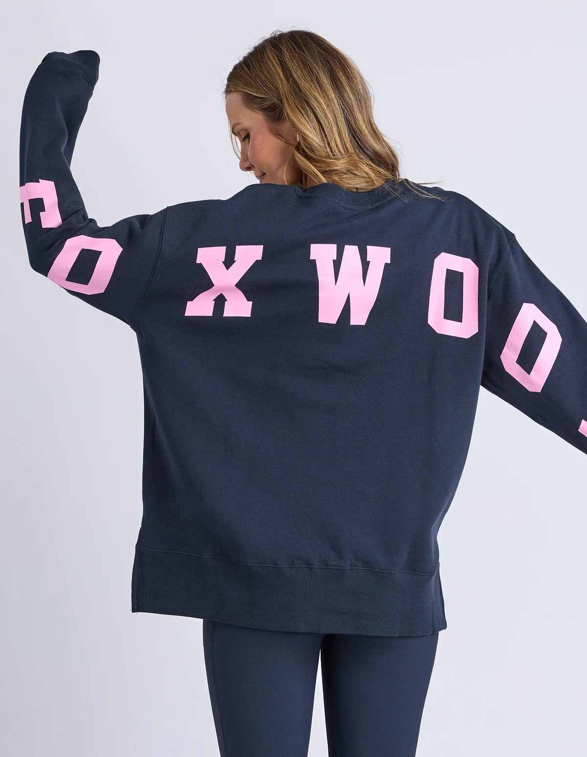 INTERVAL CREW PINK/NAVY_by_FOXWOOD_women's_in_New Zealand_ FOXWOOD Interval Crew Pink Navy women’s sweatshirt back view highlighting oversized graphic print across back and sleeves _