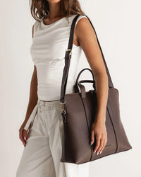 RHODES LAPTOP BAG CHOCOLATE_by_LOUENHIDE_women's_in_New Zealand_ Louenhide Rhodes Chocolate women’s laptop bag styled on luggage for travel - ready work bag in New Zealand _